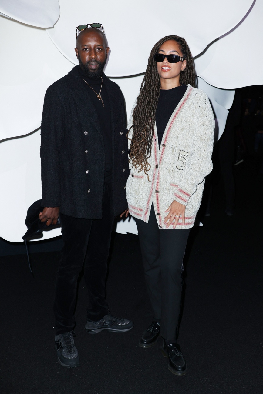 Ladj Ly and his wife at the Chanel show during Paris Fashion Week